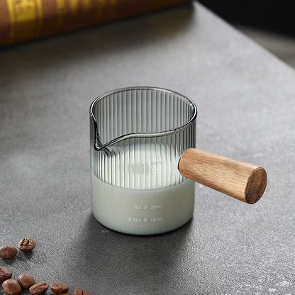 Milk frothing pitcher with wooden handle