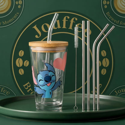 Glass tumbler with wooden lid and stitch character, metal straws, and cleaning brush on a green tray with 'jouffee' branding.